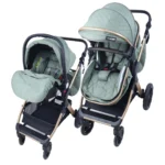 Coche de bebé tipo travel system en color verde con portabebé desmontable