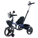 Triciclo para bebé Baby Cam tipo chopper color azul con manija de empuje, asiento acolchado, canastilla y ruedas grandes para paseos seguros.