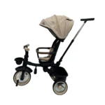 Triciclo Flex Baby Cam beige con capota, manija de empuje, asiento acolchado y canastilla, ideal para paseos seguros del bebé.