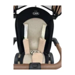 Triciclo Flex Baby Cam beige con capota, manija de empuje, asiento acolchado y canastilla, ideal para paseos seguros del bebé.