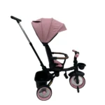 Triciclo Flex Baby Cam rosado con capota, manija de empuje, asiento acolchado y canastilla, ideal para paseos seguros del bebé.