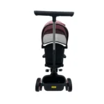 Triciclo Flex Baby Cam rosado con capota, manija de empuje, asiento acolchado y canastilla, ideal para paseos seguros del bebé.