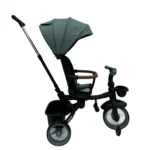 Triciclo Flex Baby Cam verde con capota, manija de empuje, asiento acolchado y canastilla, ideal para paseos seguros del bebé.
