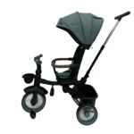 Triciclo Flex Baby Cam verde con capota, manija de empuje, asiento acolchado y canastilla, ideal para paseos seguros del bebé.