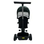 Triciclo Flex Baby Cam verde con capota, manija de empuje, asiento acolchado y canastilla, ideal para paseos seguros del bebé.