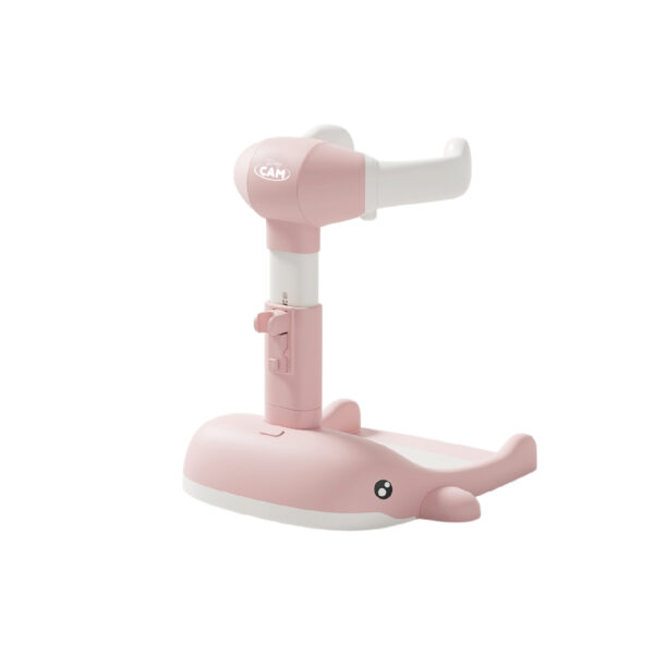 Soporte para baño Nubbi Baby Cam rosado con diseño de ballena y estructura ajustable en altura.