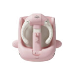 Soporte para baño Nubbi Baby Cam rosado con diseño de ballena y estructura ajustable en altura.